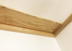 Detail of shelves installed on wall.