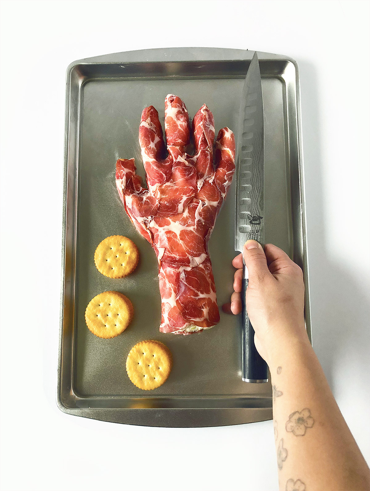Severed Hand Cheese Ball with Prosciutto and Crackers.