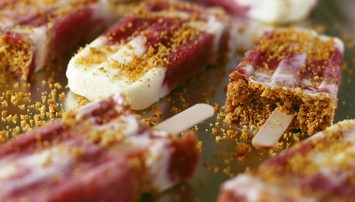 Close up of crumble on a frozen popsicle treat.