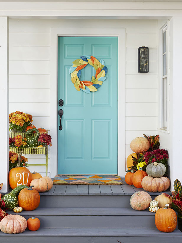  The beautiful wreath that looks like it's made from painted leaves. The pumpkin is also lovely and would be simple to make with a stencil and paint. Found on the HGTV blog.